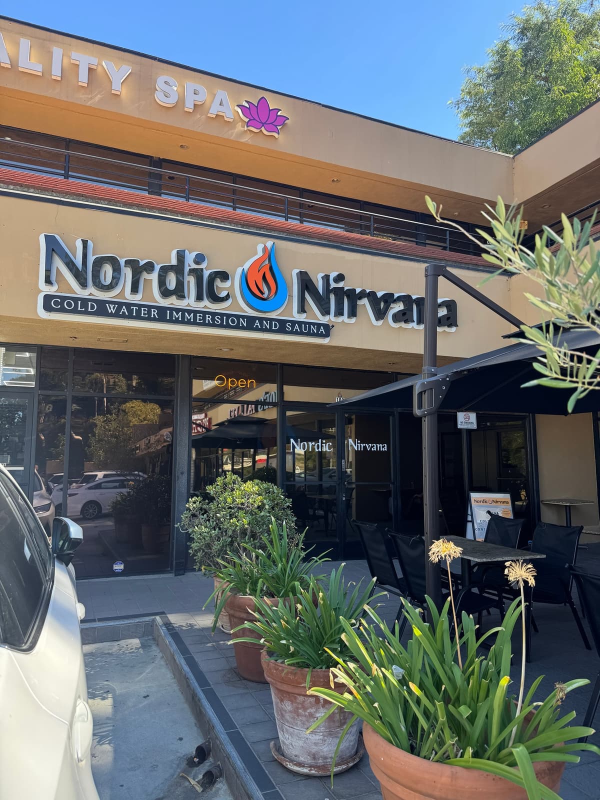Nordic Nirvana storefront on Cahuenga Blvd with patio seating and Vitality Spa upstairs