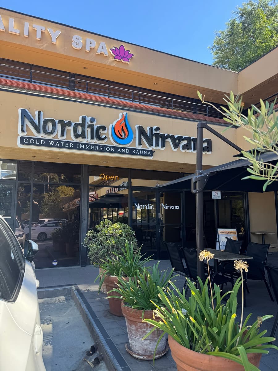 Nordic Nirvana storefront on Cahuenga Blvd with patio seating and Vitality Spa upstairs