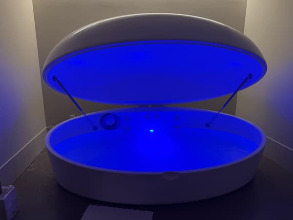 Pause Studio City white float tank open with blue interior light