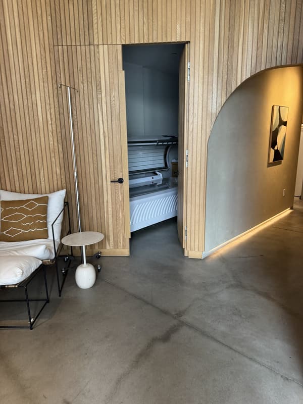 Lounge seating and suite hallway inside Pause West Hollywood